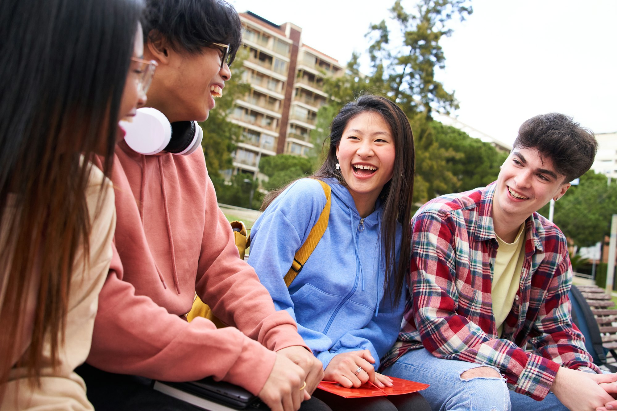 Education high school and people concept - group of happy teenage students with notebooks having fun